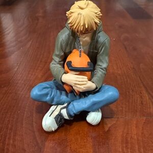 Anime Figure with Orange Chainsaw